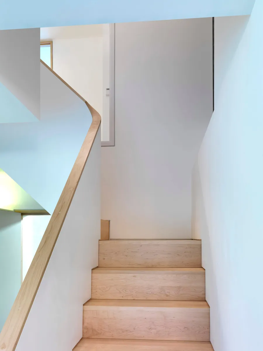 Solid maple winding staircase.