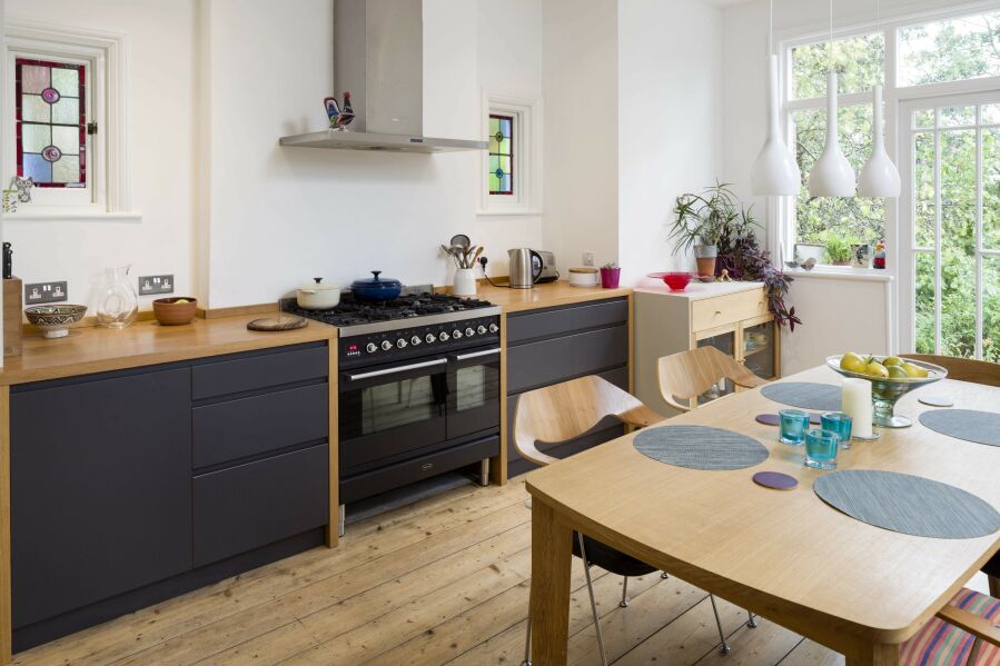 Modern kitchen with spray finished fronts and solid oak worktops..