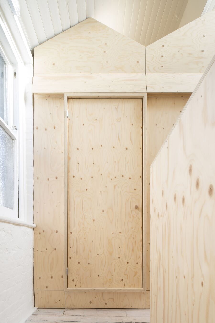 Spruce plywood office structure in a Victorian warehouse..