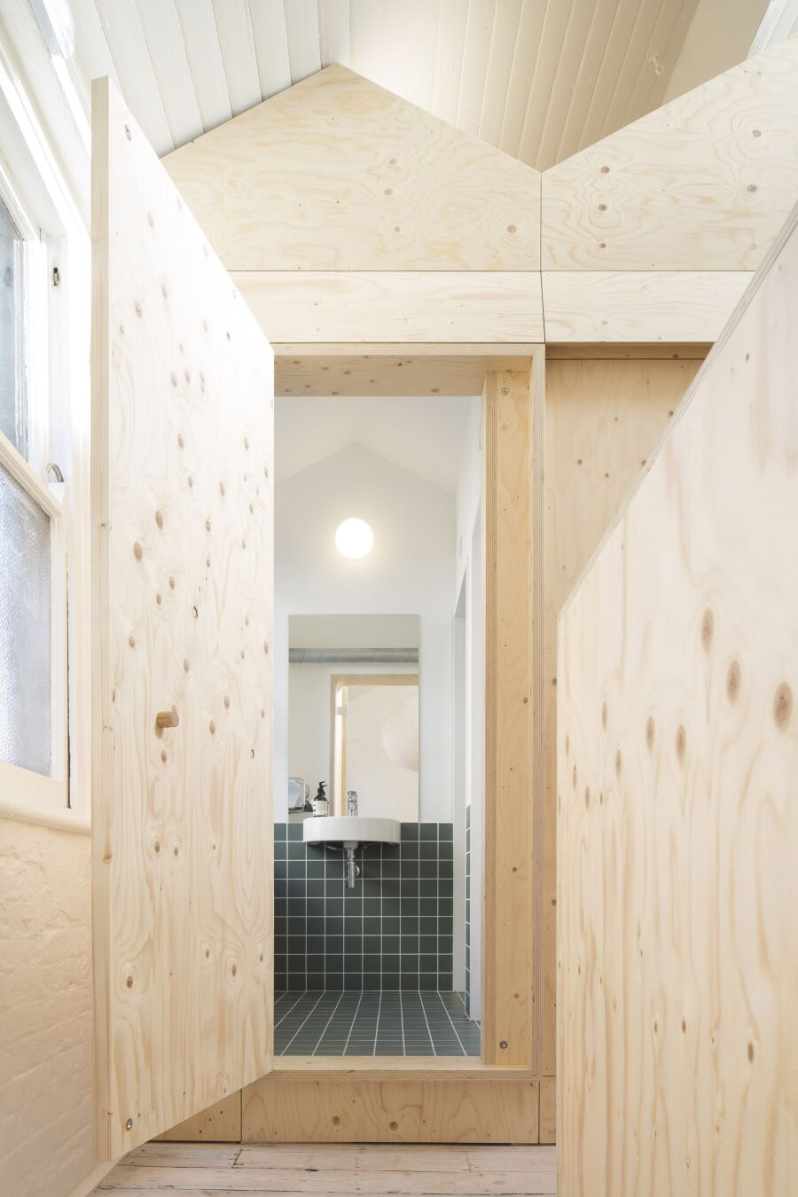 Spruce plywood office structure in a Victorian warehouse..