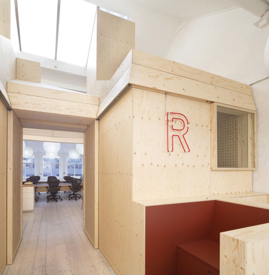 Spruce plywood office structure in a Victorian warehouse..