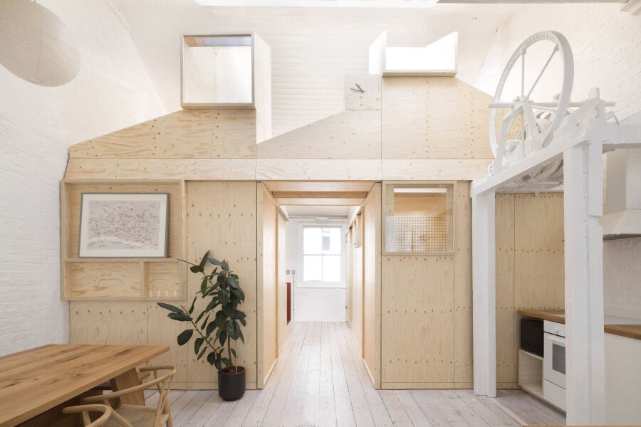 Spruce plywood office structure in a Victorian warehouse..