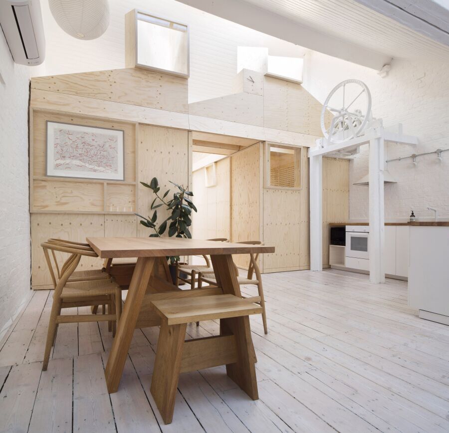 Spruce plywood office structure in a Victorian warehouse..