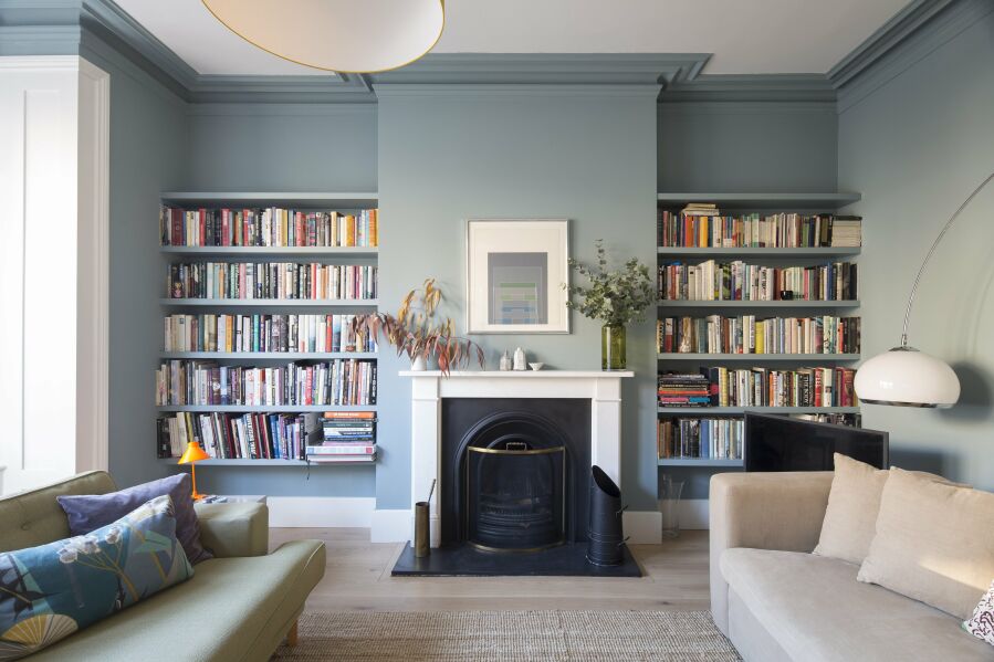 Lounge with spray finished floating alcove shelving.