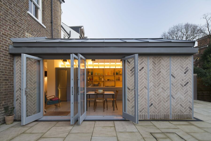 Evening external photo of finished kitchen extension.