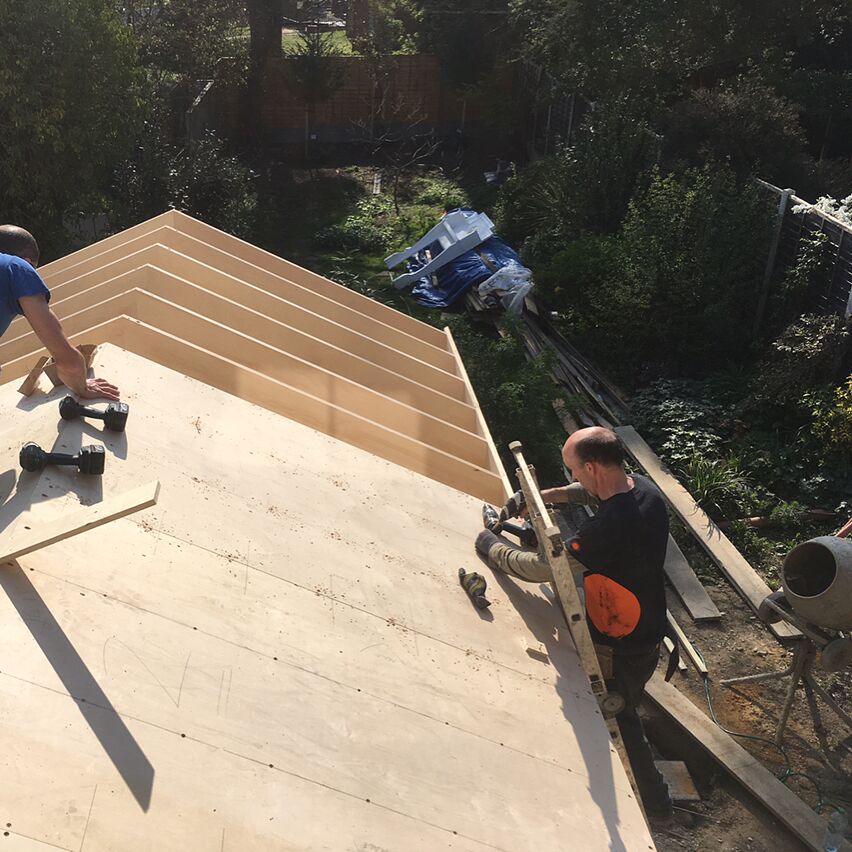 ​Constructing the plywood roof structure onsite.