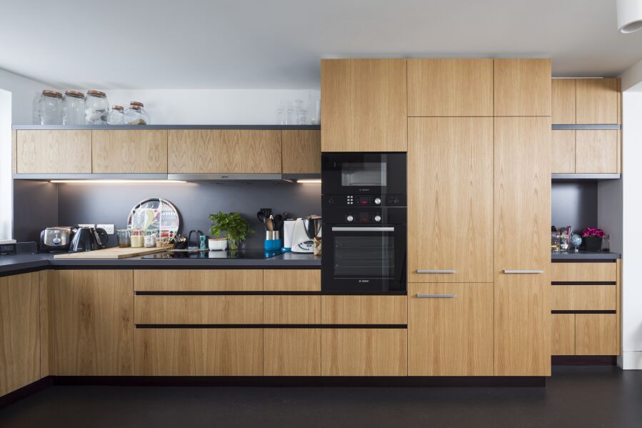 Kitchen with Oak veneered birch plywood fronts, Formica Colourcore worktops..