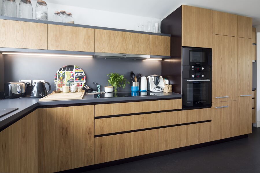 Kitchen with Oak veneered birch plywood fronts, Formica Colourcore worktops..