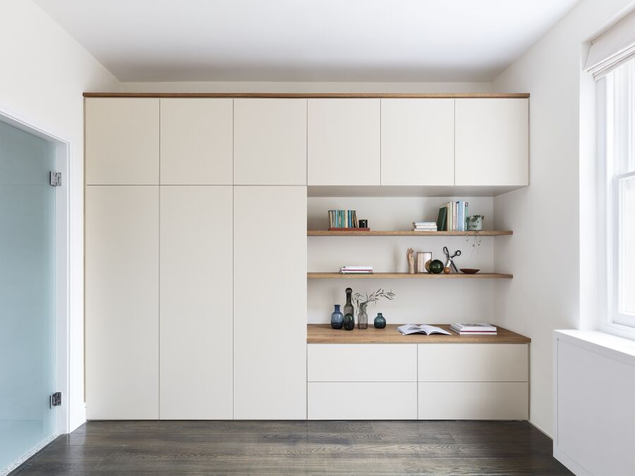 Wardrobe featuring spray finished fronts, solid oak floating shelves, top and trims..
