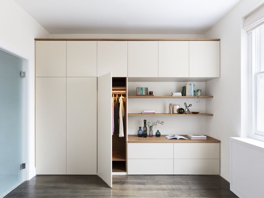 Wardrobe featuring spray finished fronts, LED lighting, solid oak floating shelves, top and trims..