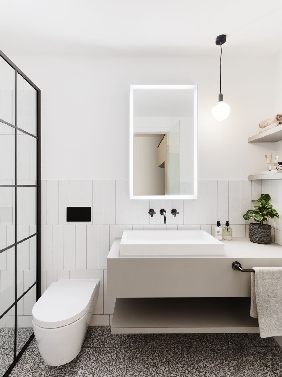 Bathroom Fenix clad sink unit with Fenix clad floating shelving.