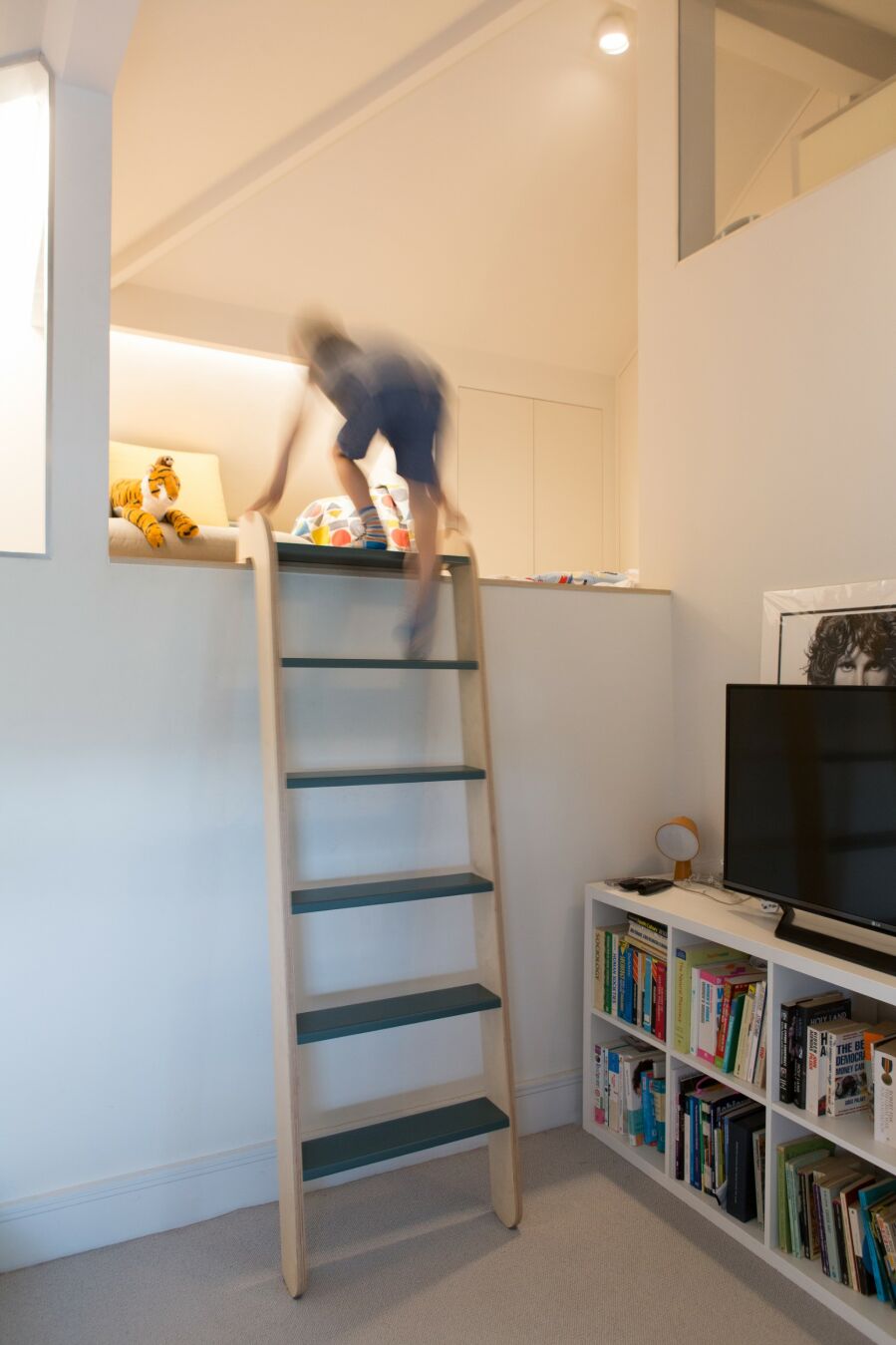 A removable, sliding loft ladder being put to good use..