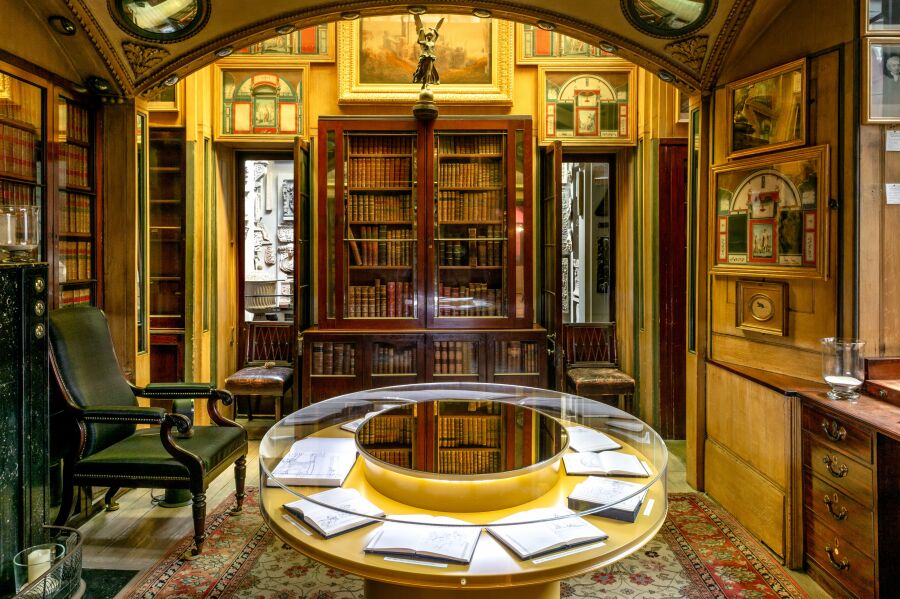 Library room with a circular perspex display cabinet..