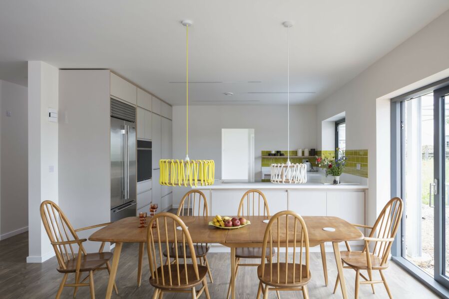 Modern kitchen with laminated birch plywood fronts and Corian worktops..