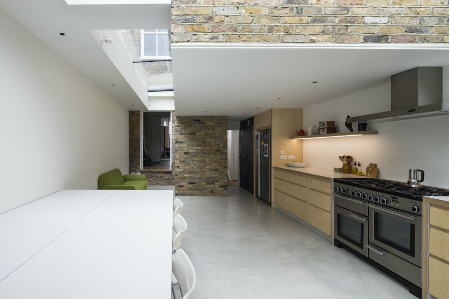 Kitchen extension with roof lights and plywood kitchen.